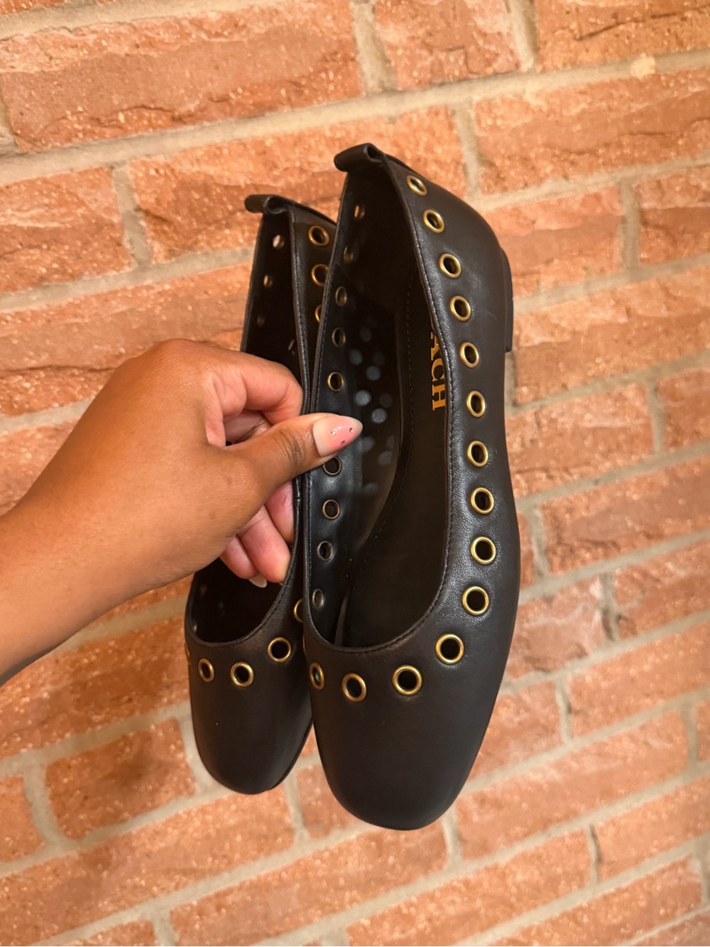 Coach Black Leather Ballet Flats with Gold Grommet Trim